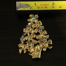 Vintage AVON Christmas Holiday Tree Brooch Pin Gold Tone Blue AB Crystals Bows - $9.60