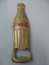 Coca-Cola Bottle Opener Gold Tone Cast Iron Bottle Shaped Script Logo - $5.94