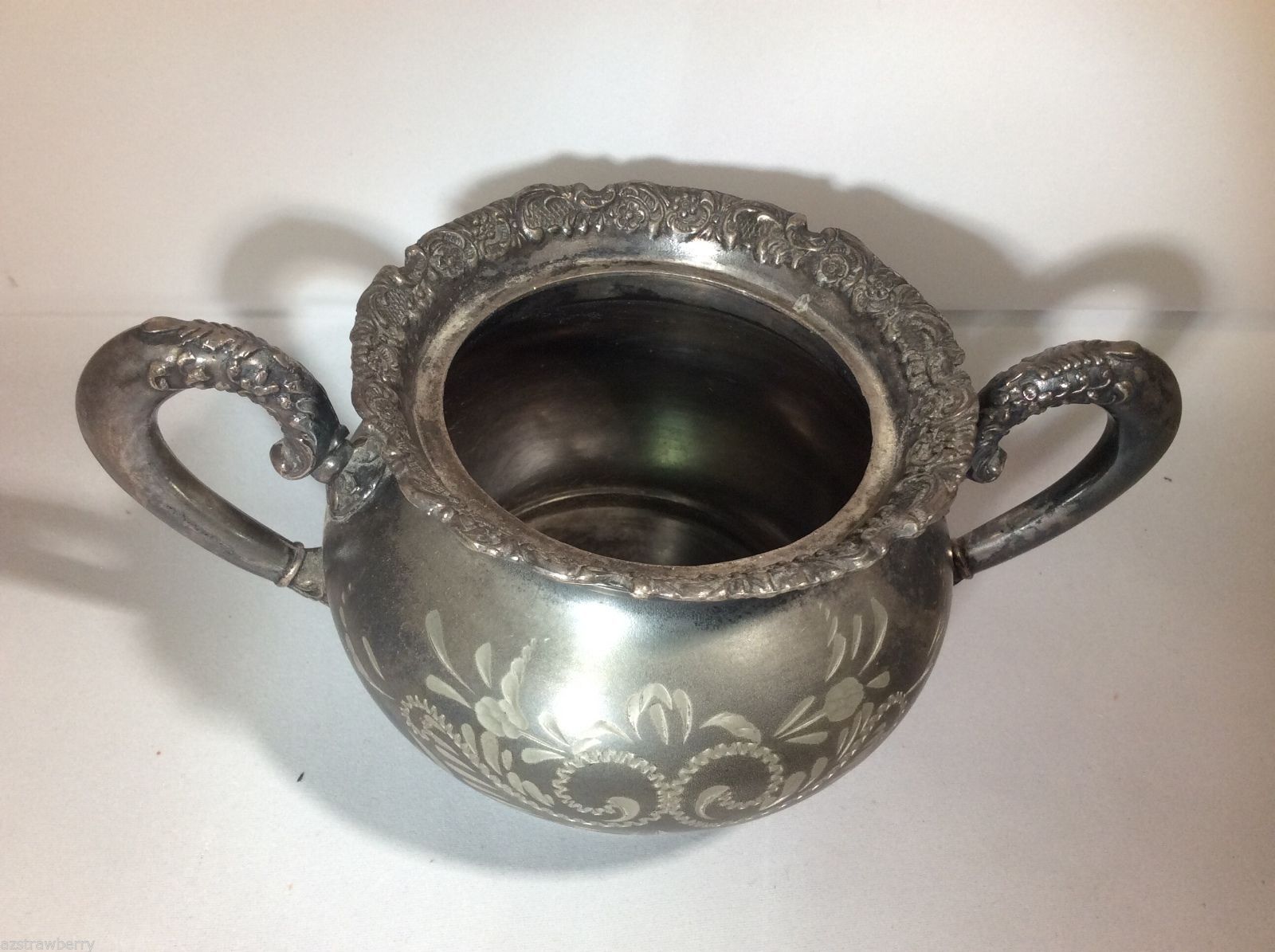 silver and silver plate: St. Louis Silver Syrup Pitcher