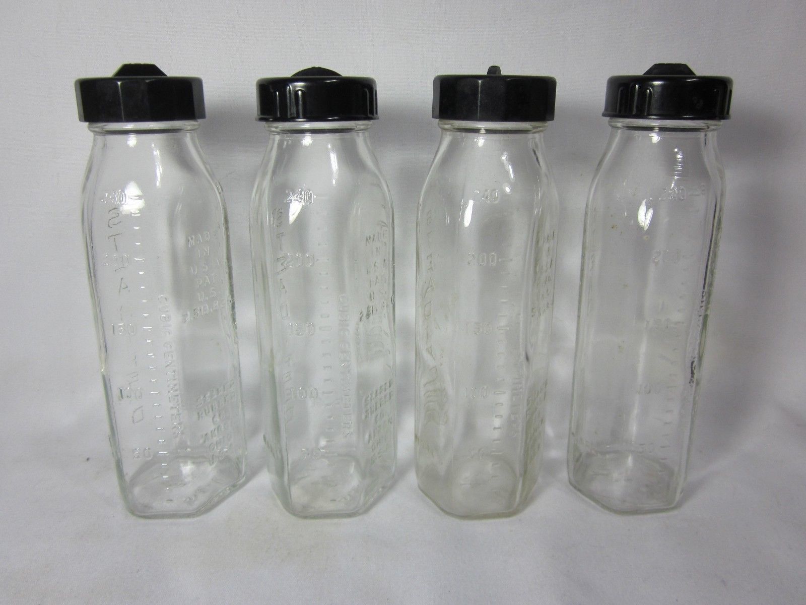 Four Vintage Clear Glass Bottles – Small Town Antiques