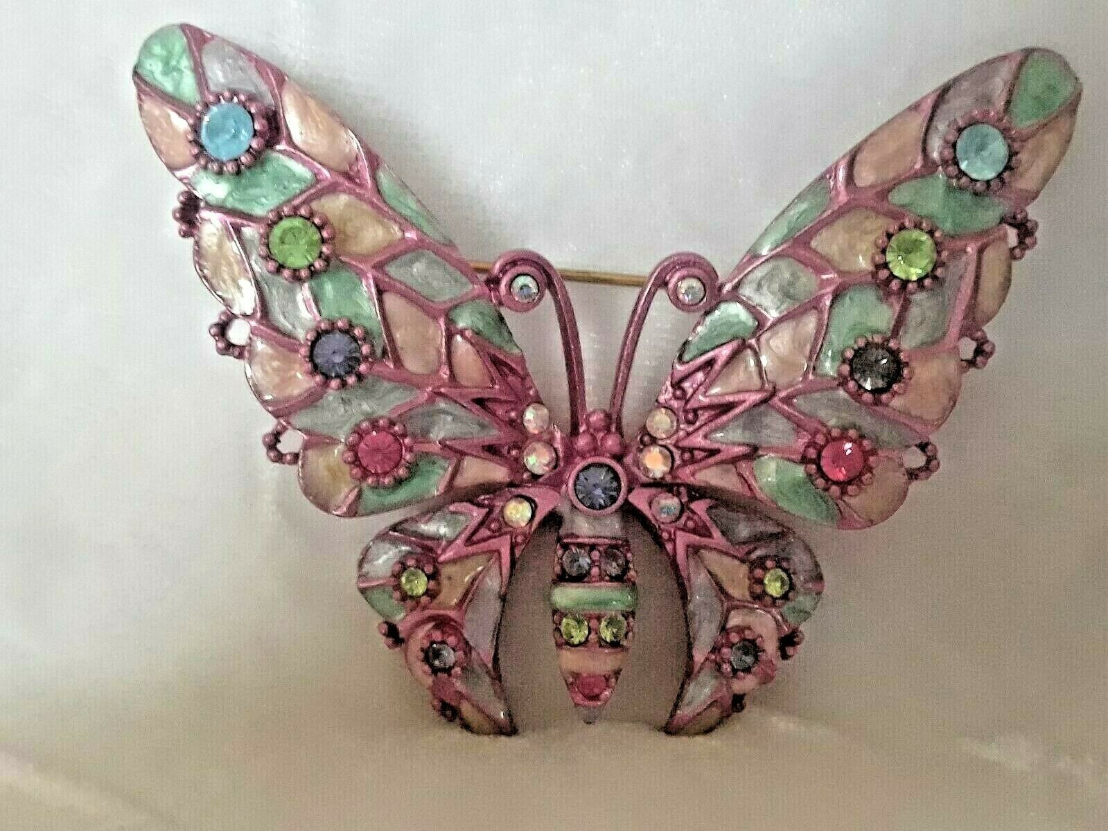 At Auction: Silver tone white faux pearl, clear and iridescent rhinestones,  purple enamel butterfly brooch