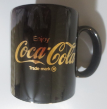Coca-Cola  Black Cermaic Coffee Mug with Gold Enjoy Coca-Cola 10 ounces - $4.70