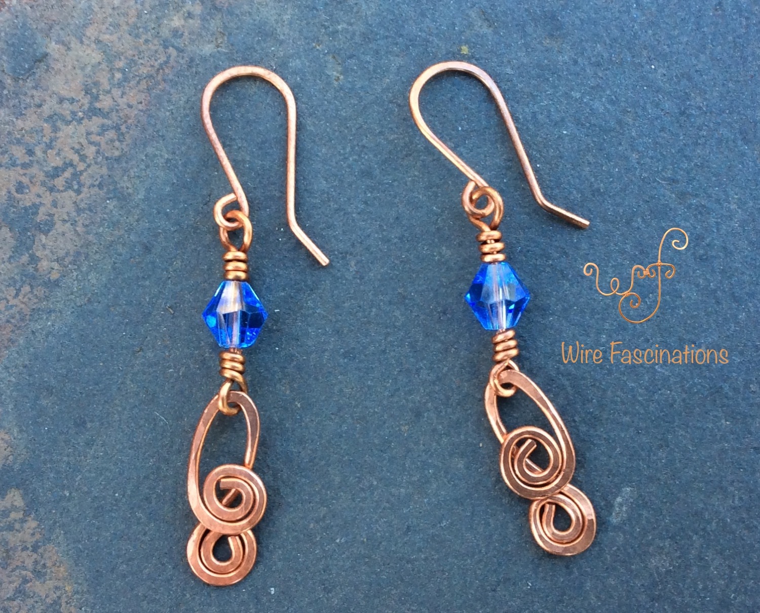 Handmade copper earrings: blue bicone crystal with double spiral dangle ...