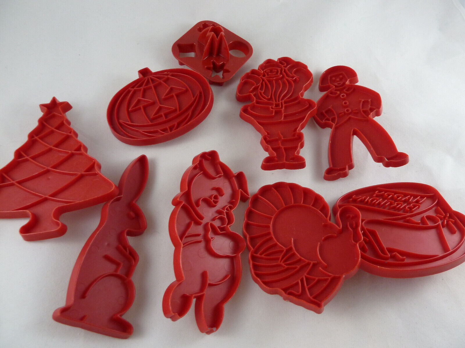 Tupperware red plastic holiday cookie cutters - vintage baking