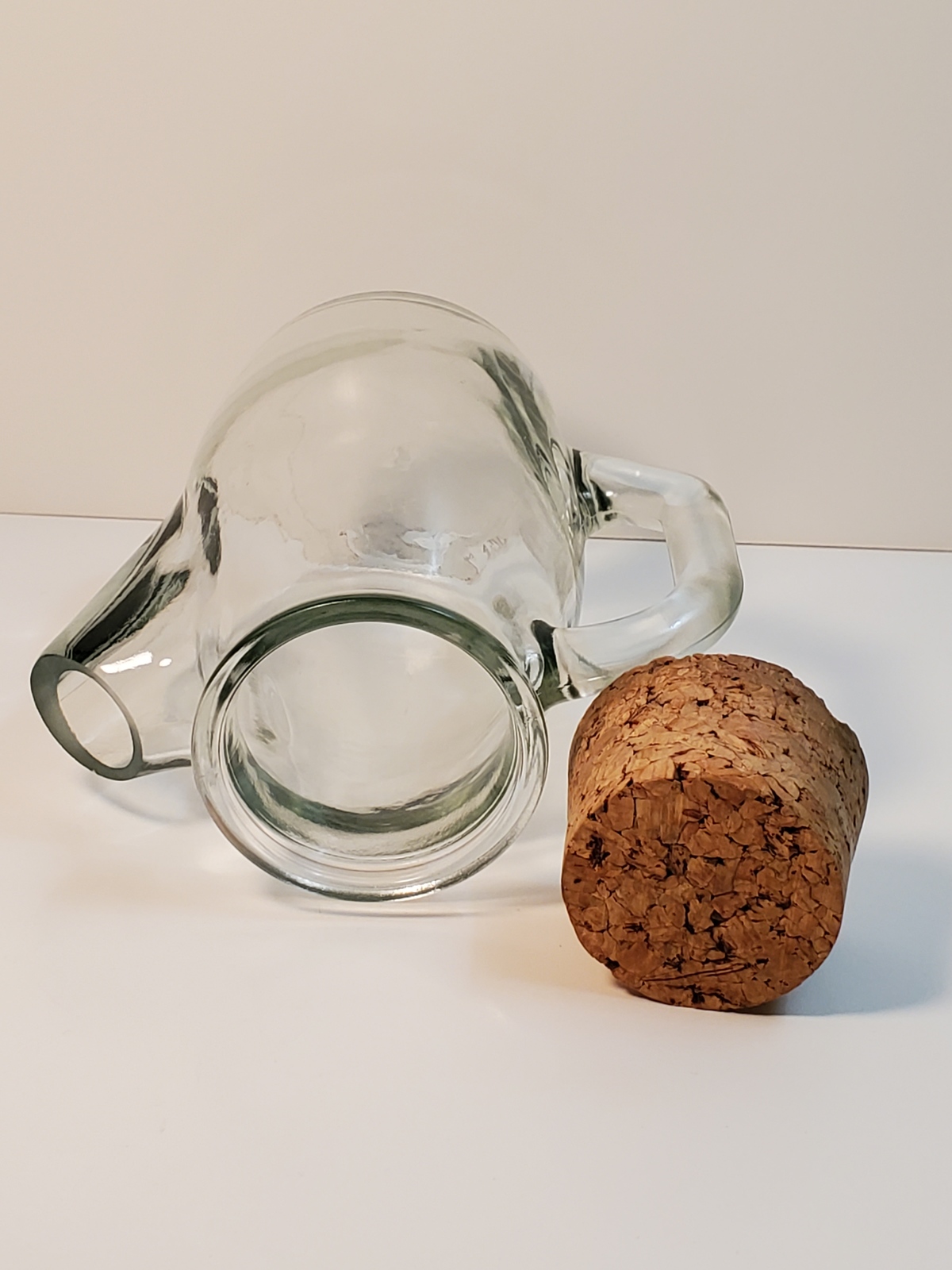Small glass pitcher with cork stopper