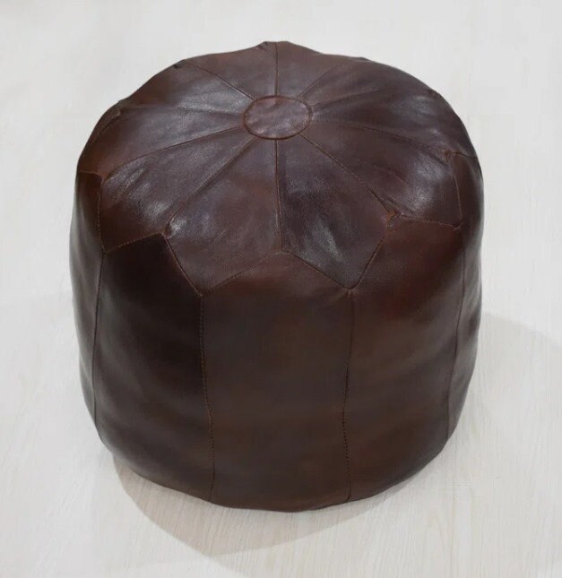 Round pouf , brown , extra seating space , foot stool , coffee table