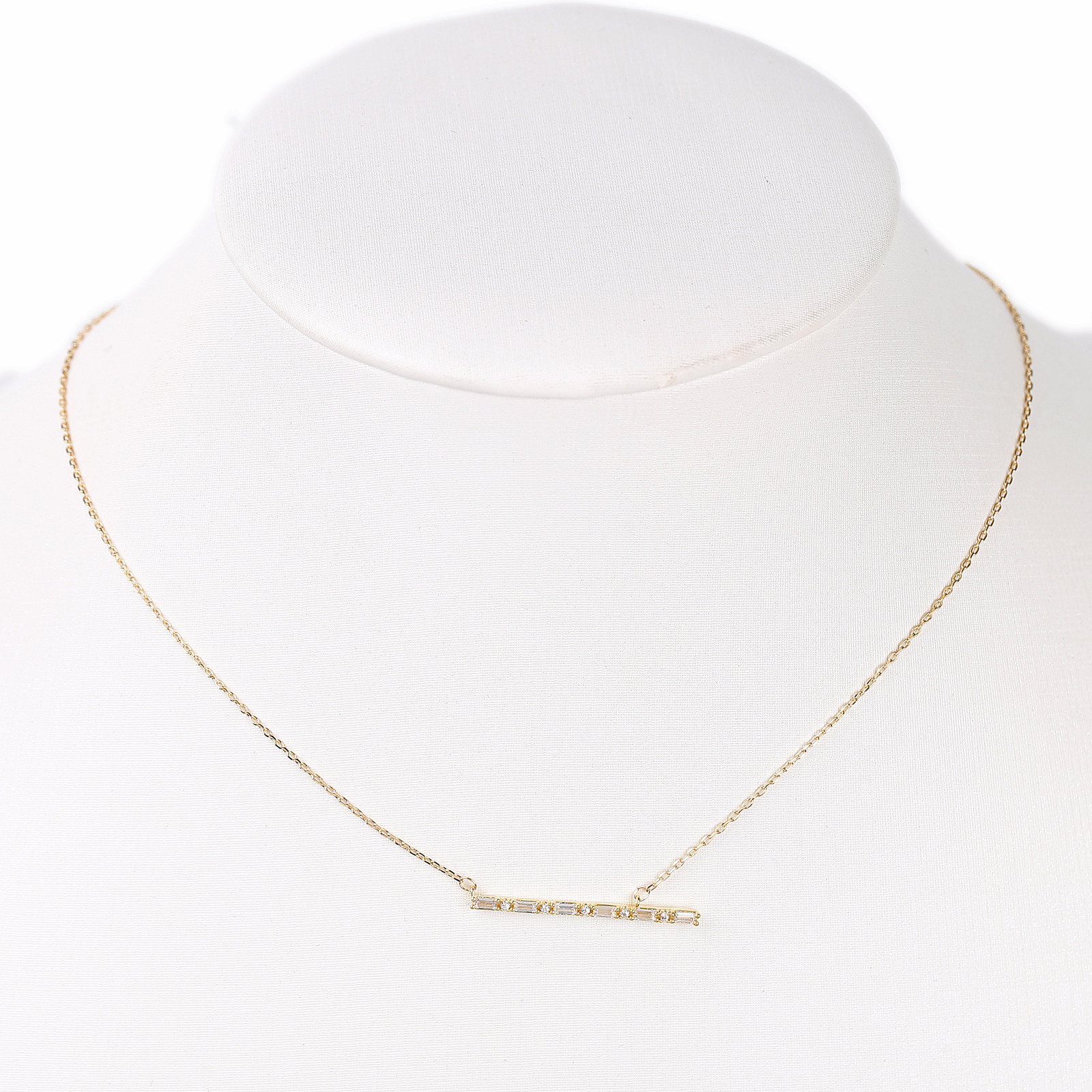 gold tone bar necklace with sparkling swarovski style crystals