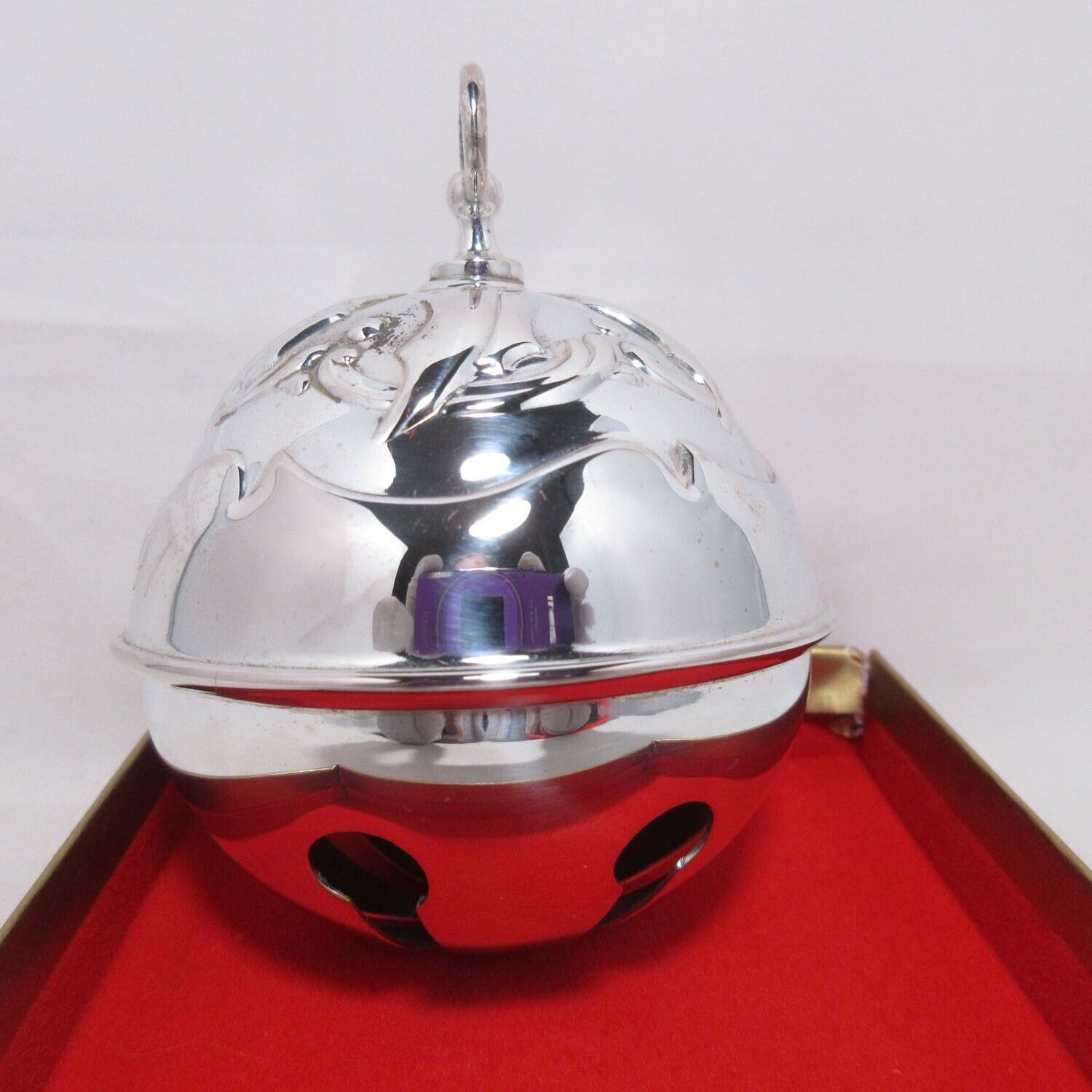 The 1991 Holly Bell by Reed & Barton Silver Plated Christmas Ornament