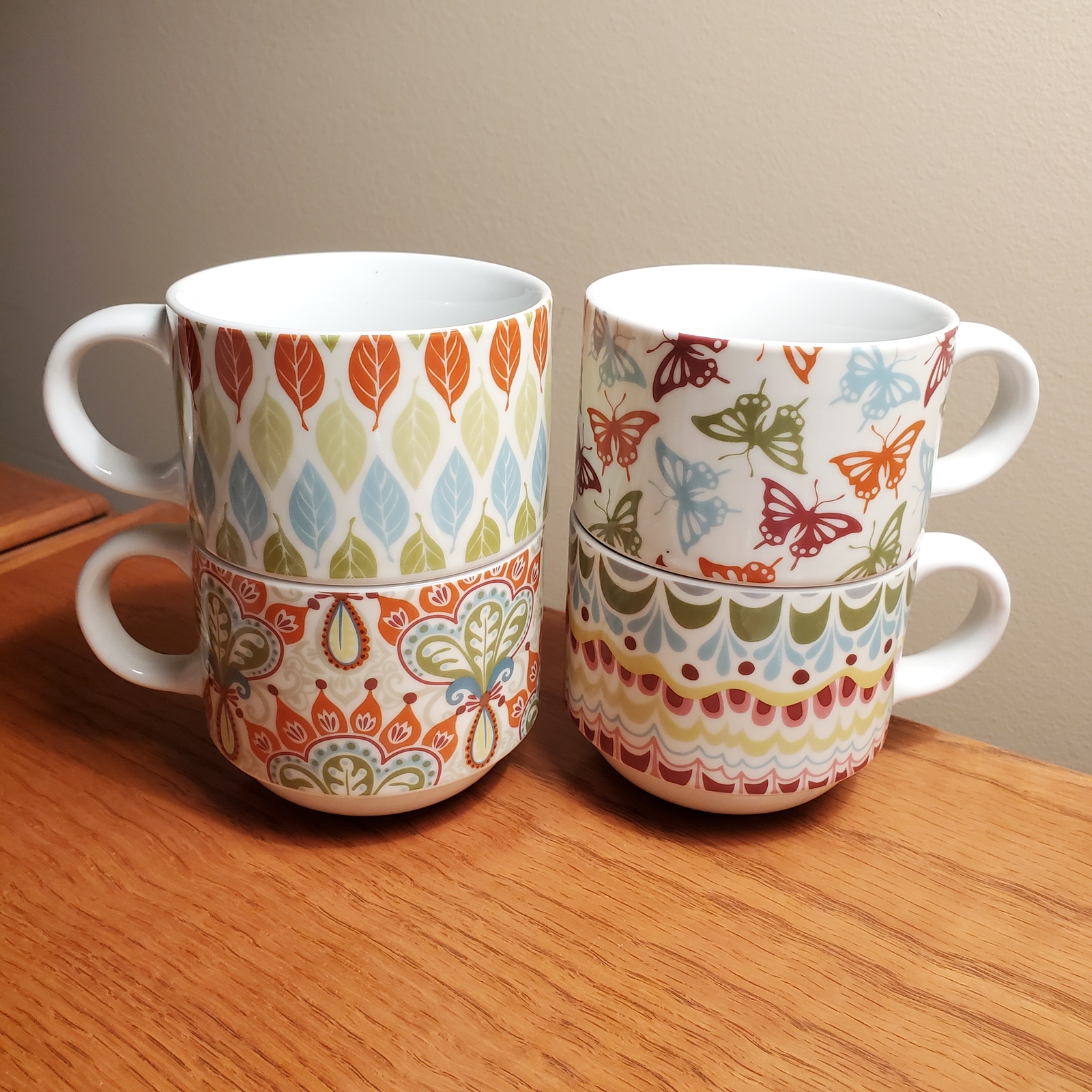 Pier One stackable Coffee Mugs, set of 4, butterfly paisley leaves