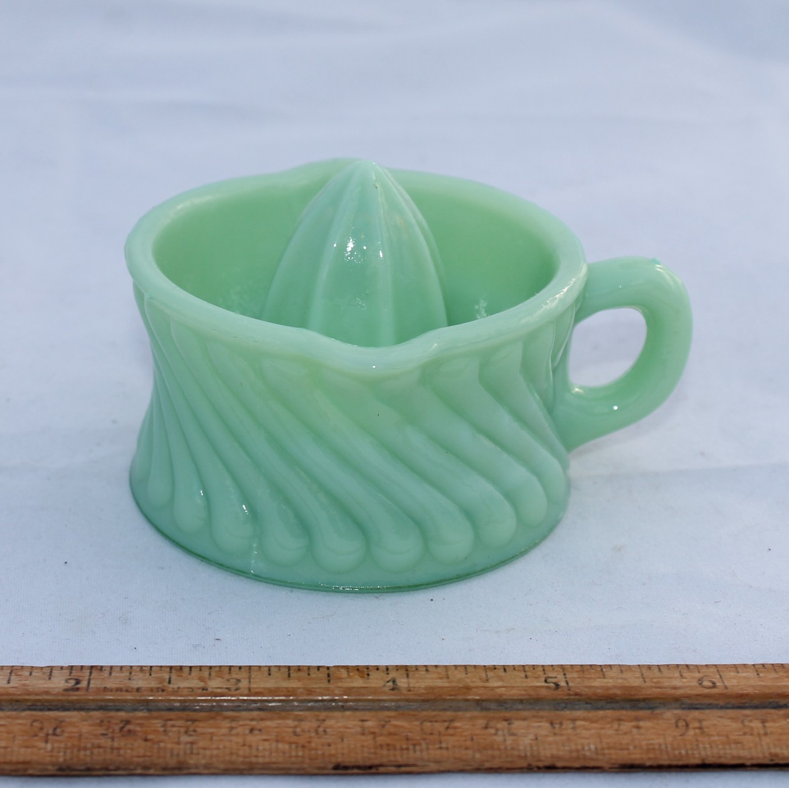 Confusing Measuring Cup with Reamer in Blue Glass