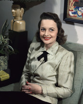 Olivia de Havilland plaid outfit sitting near statue smiling 16x20 Canvas Giclee - $69.99